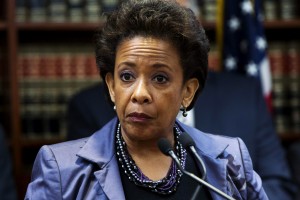 United States Attorney Loretta E. Lynch speaks during an announcement of the arrest of Abraxas J. ("A.J.") Discala, CEO of OmniView Capital, and six co-conspirators for fraudulent market manipulation at the U.S. Attorney's office in Brooklyn, New York